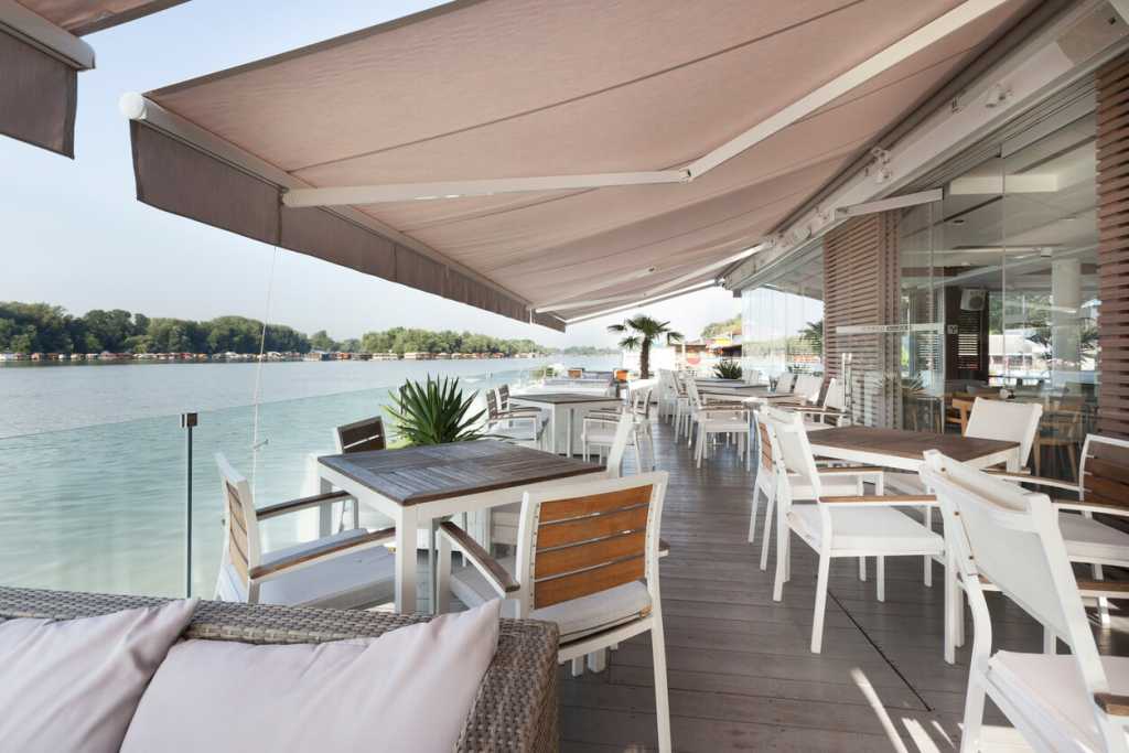 taupe canopy on the outdoor lakeside bar