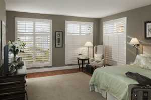 pvc shutters in a green bedroom