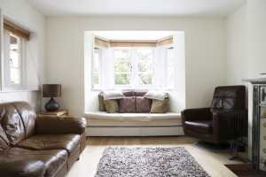 Living Room with bay window and venetian blinds