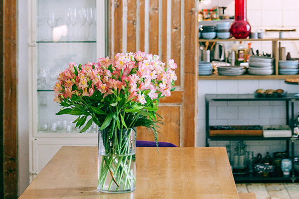 Spring flower arrangement on kitchen table